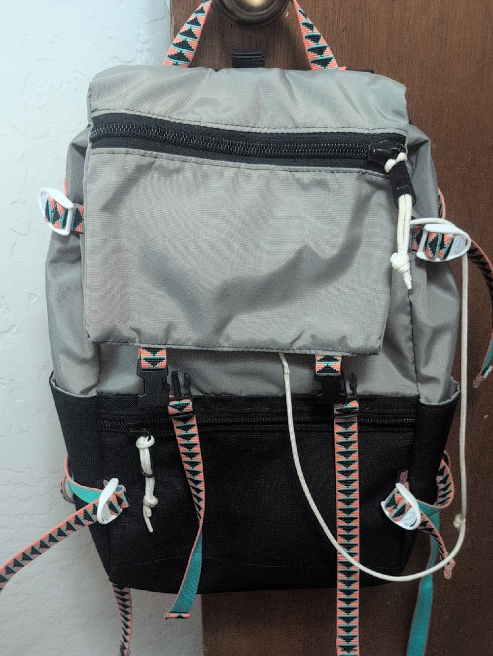 Topo Designs Gray and Black Backpack with Coral and Teal Accent Straps